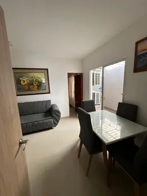 a living room with a table and a couch at APARTAMENTO in Cartagena de Indias