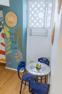 a table and chairs in a room with a window at King's Apartments 302 in Cartagena de Indias