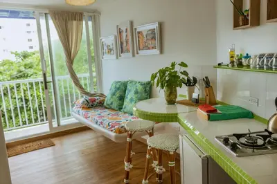 a kitchen and living room with a couch and a table at King's Apartments 302 in Cartagena de Indias