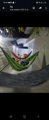 a picture of a hammock in a room at Apartment by the sea in Puerto Colombia