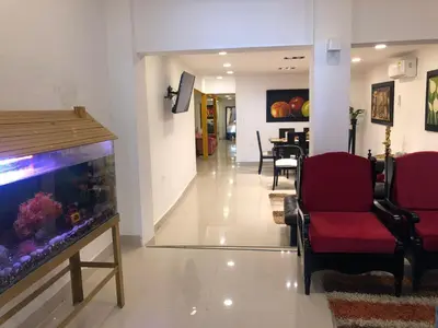 a living room with a fish tank in a room at Martinica Hostel in Cartagena de Indias