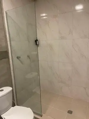 a bathroom with a glass shower with a toilet at Abel Boutique House in Cartagena de Indias