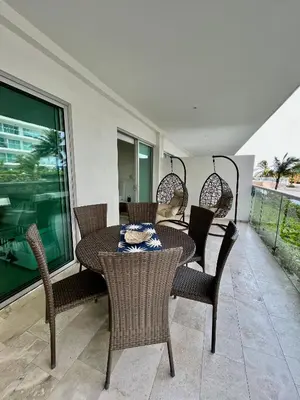 a dining table and chairs on a porch with a window at MORROS EPIC 1111 in Cartagena de Indias