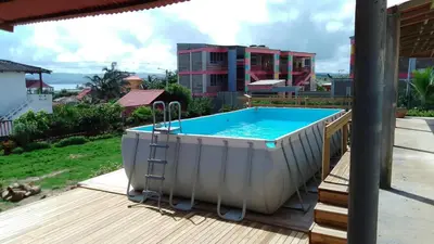 a hot tub on the deck of a house at Villa Nuevo Amanecer Santa Verónica in Santa Veronica
