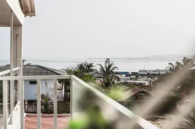 a balcony of a house with a view of the ocean at Villa Nuevo Amanecer Santa Verónica in Santa Veronica