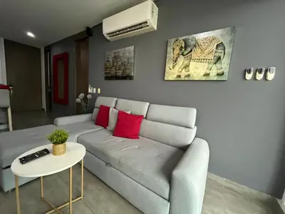 a living room with a couch and a table at Morros Cartagena junto al Hotel las Américas Edificio Spiaggia salida a playa in Cartagena de Indias