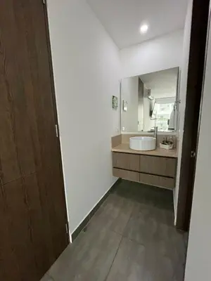 a bathroom with a sink and a mirror at Morros Cartagena junto al Hotel las Américas Edificio Spiaggia salida a playa in Cartagena de Indias