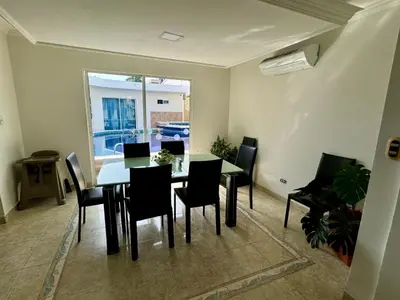 a dining room with a table and chairs at Casa palma Cartagena de Indias, Colombia in Cartagena de Indias