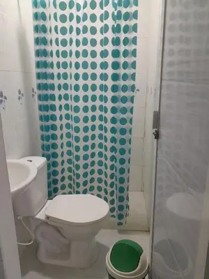 a bathroom with a toilet and a shower at PLAYA MAG in Coveñas