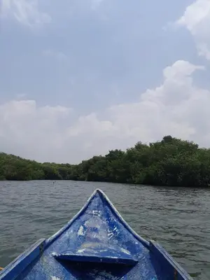 a blue kayak on a body of water at PLAYA MAG in Coveñas