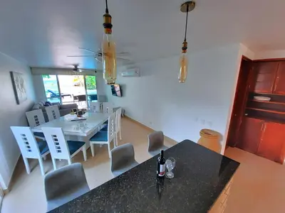 a kitchen and dining room with a table and chairs at Beach Villa Sol & Mar Cartagena, beachfront & private pool in Cartagena de Indias