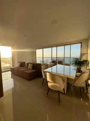 a living room with a table and a couch at La mejor vista al mar y ubicacion en Cartagena in Cartagena de Indias