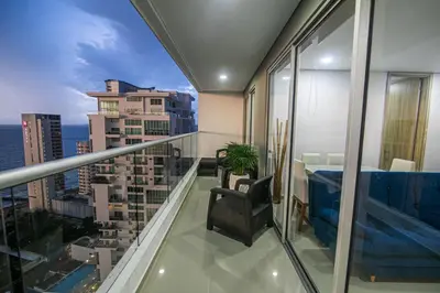 a balcony with a chair and a view of a city at La mejor vista al mar y ubicacion en Cartagena in Cartagena de Indias
