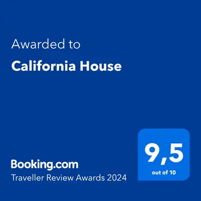 a blue sign with the text awarded to california house at California House in Santa Veronica