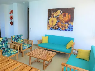 a living room with a couch and chairs and a painting at Magico Apartamento Frente al Mar 3 Habitaciones PAZ224 in Coveñitas
