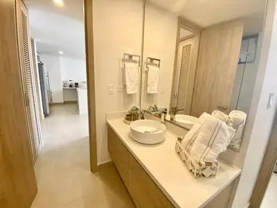a bathroom with a sink and a mirror at Apartamento de Lujo Morros Zóe - Manzanillo - Cartagena in Cartagena de Indias
