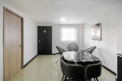 a dining room with a table and chairs at Bahari Cartagena Suites in Cartagena de Indias