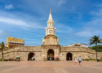 a building with a clock tower on top of it at Bahari Cartagena Suites in Cartagena de Indias