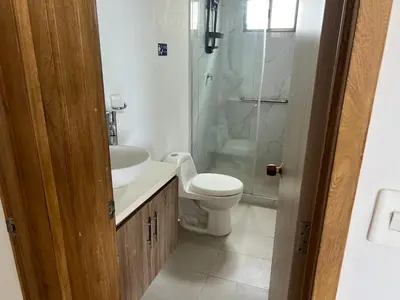 a bathroom with a toilet and a sink and a shower at Apartamento con vista al mar in Cartagena de Indias