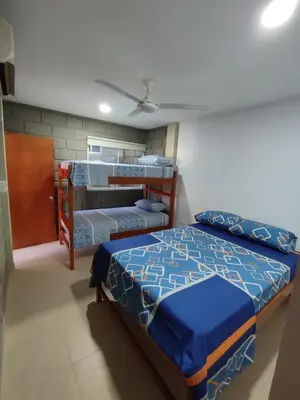 a bedroom with two bunk beds in a room at Rancho Ayala II in Santa Marta