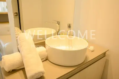 a bathroom with a white sink and a mirror at Loft Distrito 90 in Barranquilla