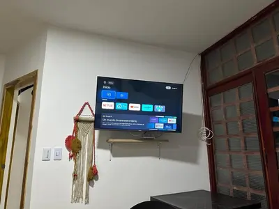 a flat screen tv on a wall in a room at Cabaña #5 en Condominio Mar de Coveñas in Coveñas