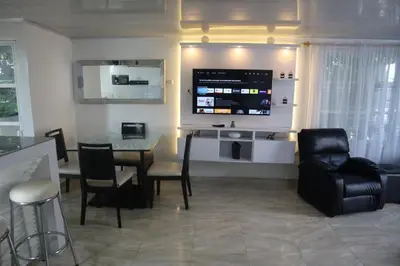 a living room with a table and chairs at Penthouses La Fe in Cartagena de Indias