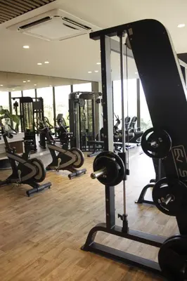 a gym with rows of treadmills and ellipticals at Apartaestudio acceso al mar in Cartagena de Indias