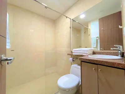 a bathroom with a shower and a toilet and a sink at Hotel Prado 72 INN in Barranquilla