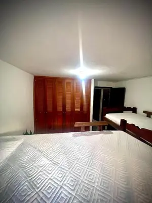 a bedroom with a bed and a light on the ceiling at Apartamento encanto in Cartagena de Indias