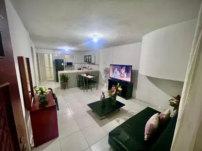 a living room with a couch and a tv at Apartamento encanto in Cartagena de Indias