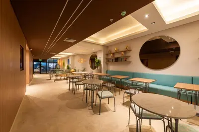 a row of tables and chairs in a restaurant at Hotel Rilux Cartagena in Cartagena de Indias