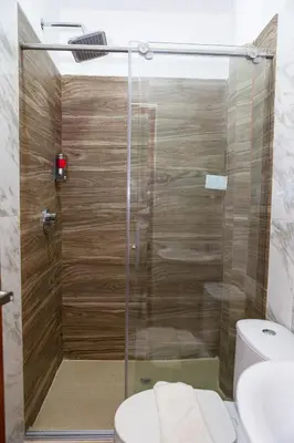 a glass shower in a bathroom with a toilet at Markasa Hotel boutique in Cartagena de Indias