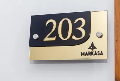 a sign on a wall with the number at Markasa Hotel boutique in Cartagena de Indias