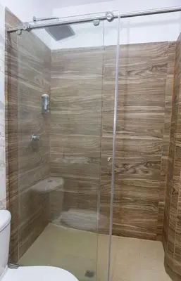 a shower with a glass door in a bathroom at Markasa Hotel boutique in Cartagena de Indias