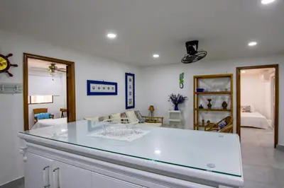 a kitchen with a glass counter top in a room at Apartamento con salida a la playa in Santa Marta