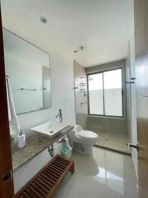 a bathroom with a toilet and a sink and a mirror at Apartamento con vista al mar in Cartagena de Indias