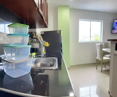 a kitchen with a sink and some containers on the counter at Apartamento 405 in Cartagena de Indias