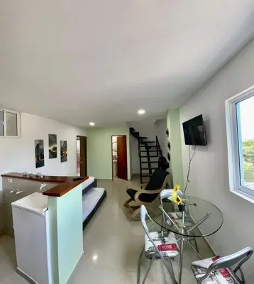 a person sitting on a bed in a room at Apartamento 403 in Cartagena de Indias