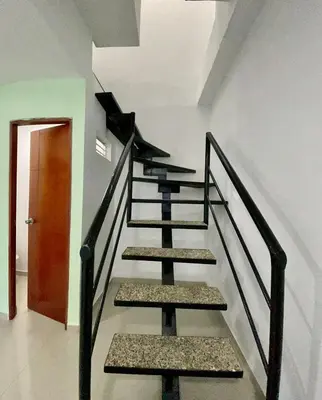 a set of stairs in a room with a door at Apartamento 403 in Cartagena de Indias