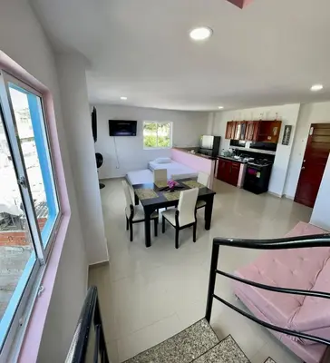 a kitchen and dining room with a table and chairs at Apartamento 408 in Cartagena de Indias