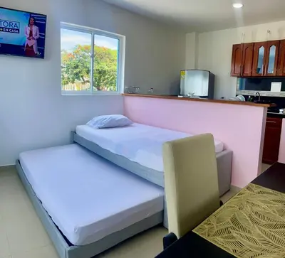 a bedroom with two beds and a window at Apartamento 408 in Cartagena de Indias