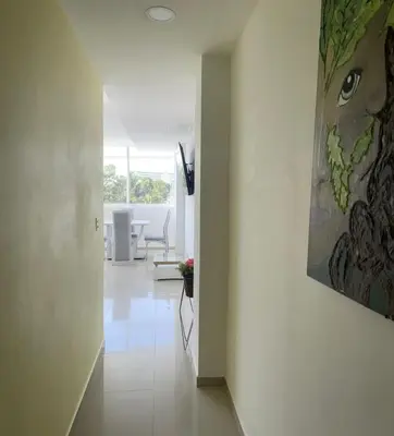 a living room with a painting on the wall at Apartamento 301 in Cartagena de Indias