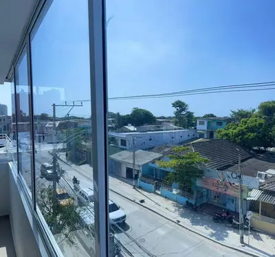 a view of a city from an office window at Apartamento 301 in Cartagena de Indias