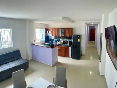 a kitchen and living room with a couch and a refrigerator at Apartamento 204 in Cartagena de Indias