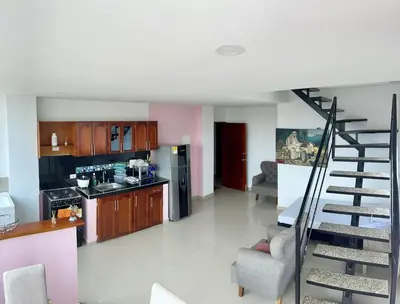 a kitchen and a staircase in a living room at Apartamento 402 in Cartagena de Indias