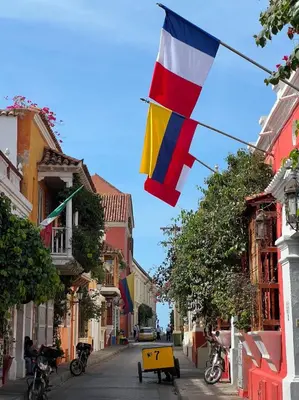 a flag flying in the middle of a street at Loft en Casa Colonial del Centro Histórico de Cartagena in Cartagena de Indias