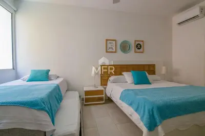 two beds in a white room with blue sheets at MORROS 922 APTO 3 ALCOBAS in Cartagena de Indias