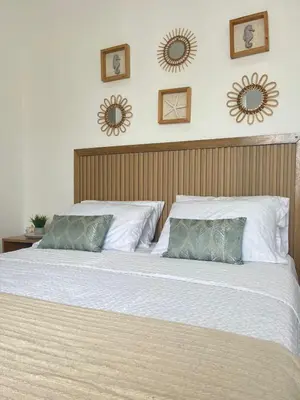 a bedroom with a large bed with two pillows at Coveñas Apartamento vacacional caribe campestre 9-502 in Coveñas