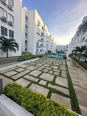 a courtyard of a apartment complex with buildings at Coveñas Apartamento vacacional caribe campestre 9-502 in Coveñas